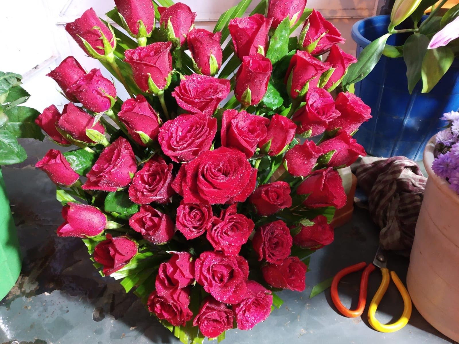 Dewy Scarlet Velvet Heart crafted on palm leaves at SMG FLOWER