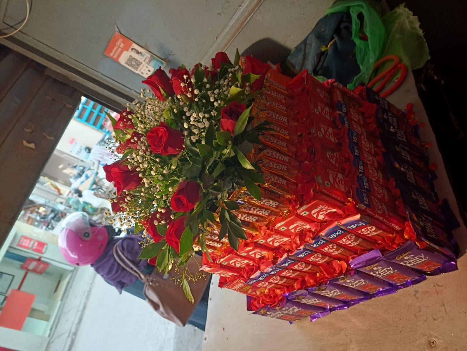 Artisanal tiered chocolate tower cake and red velvet roses signature creation