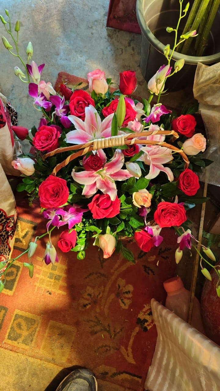 Grand stargazer lilies and exotic botanical orchid living basket